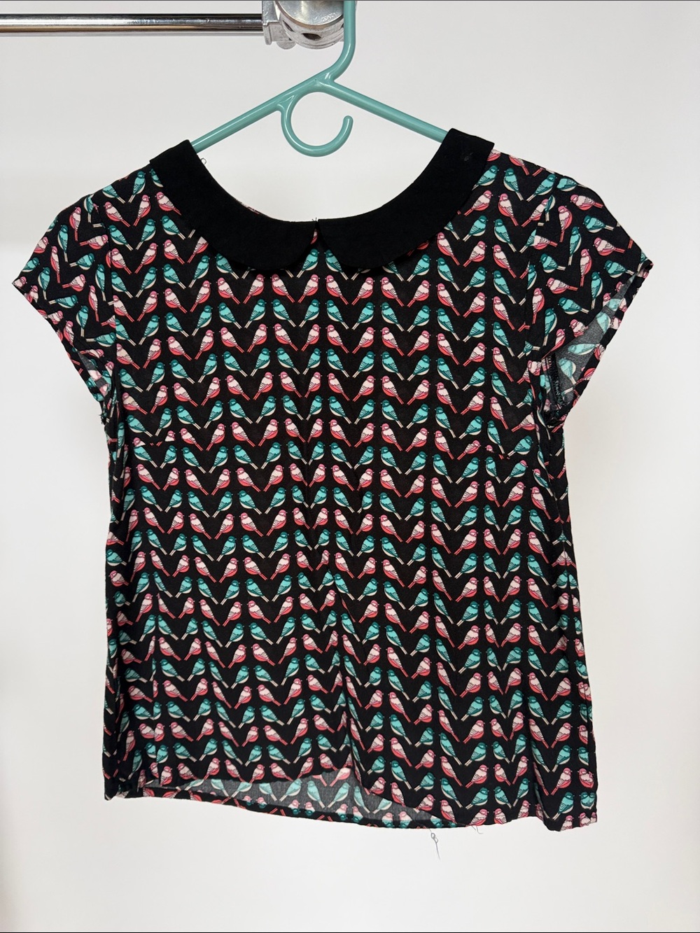 Divided Black Short-Sleeve Blouse with Pink and Teal Bird Print Peter Pan collar